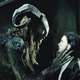 A monster and a little girl in a scene from Pan's Labyrinth.